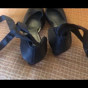 Beautiful satin ankle tie fabric and leather heel.